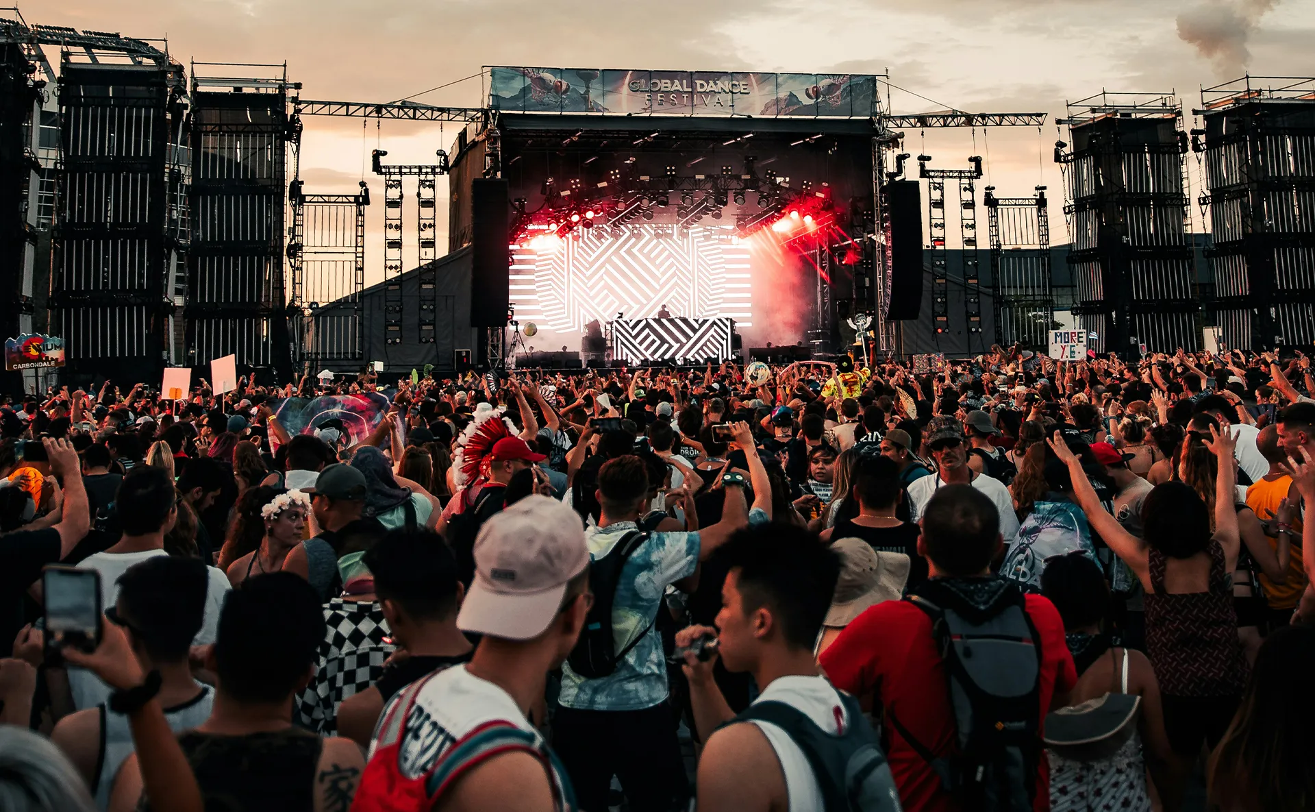 Outdoor festival stage with fireworks and a large crowd at a live music event, representing memorable entertainment experiences.